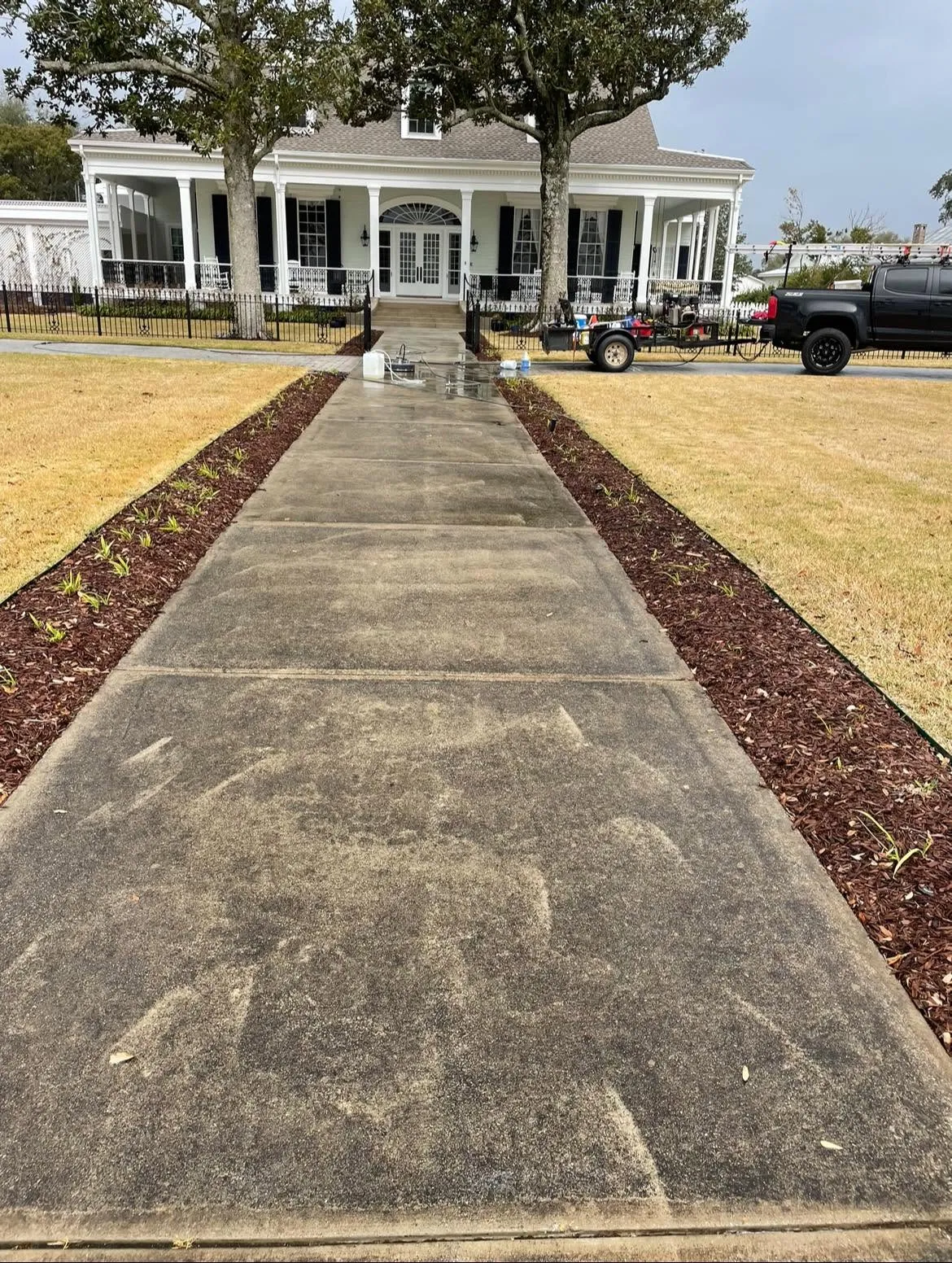 Concrete cleaning in progress, dirty to clean in one pass.